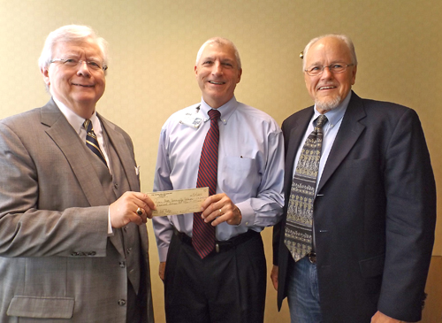 Paul Phillips (left), executive director of the Roane State Foundation, and Dr. Michael Laman (right), Roane State dean of allied health sciences, accept a $2,000 donation from The Foundation for Geriatric Education, represented by Jeff Tambornini (center) of NHC HealthCare, Oak Ridge.