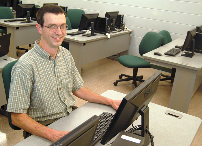 Photo of student Joe Pyle in a computer lab