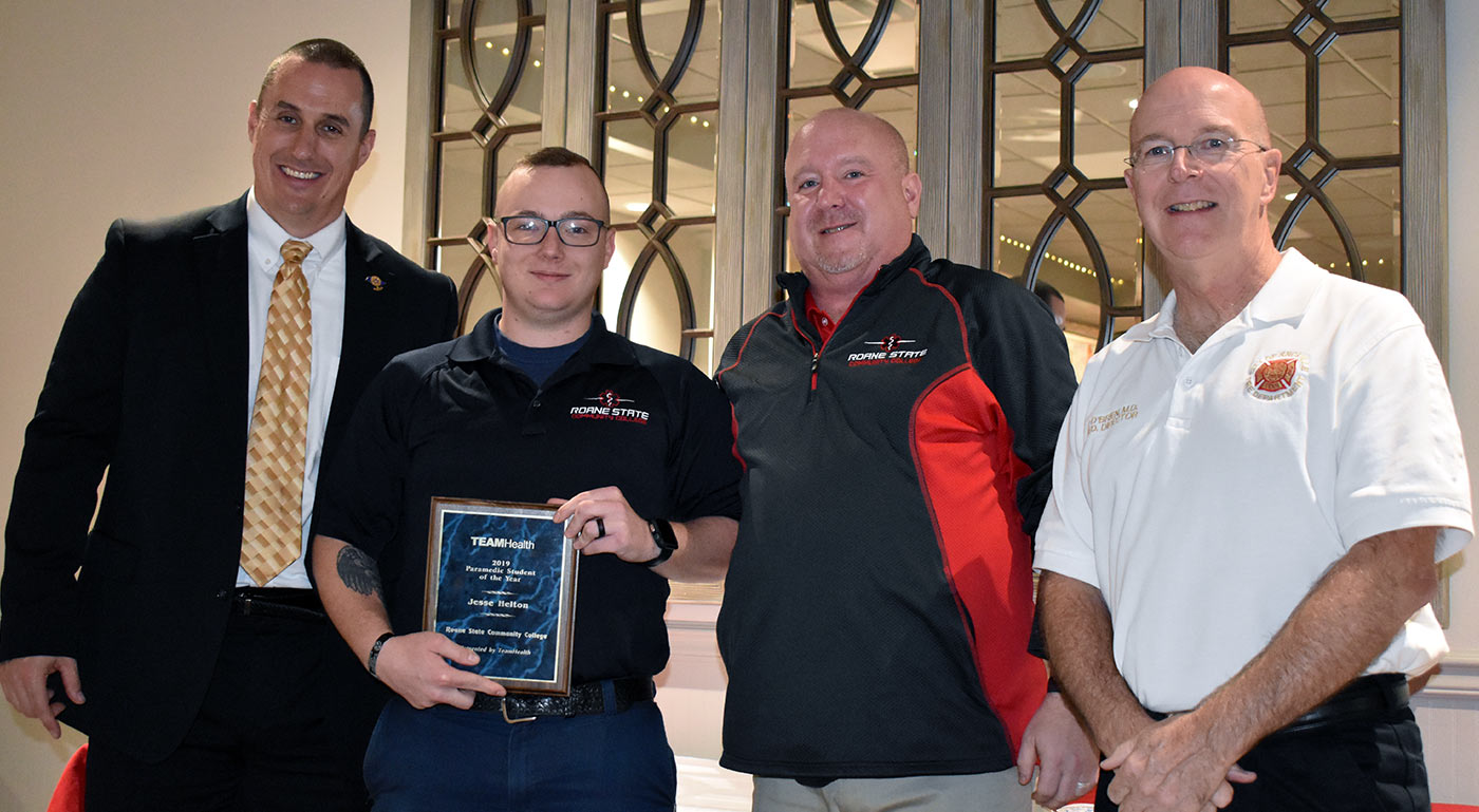 Jesse Helton, second from left, was honored as the Paramedic of the Year during a program on the eve of their graduation from the three-semester course. From left: David Blevins, director of EMS education, Helton, Assistant Professor Tom Herron and Dr. Pat O’Brien, medical director for Roane State’s EMS program.
