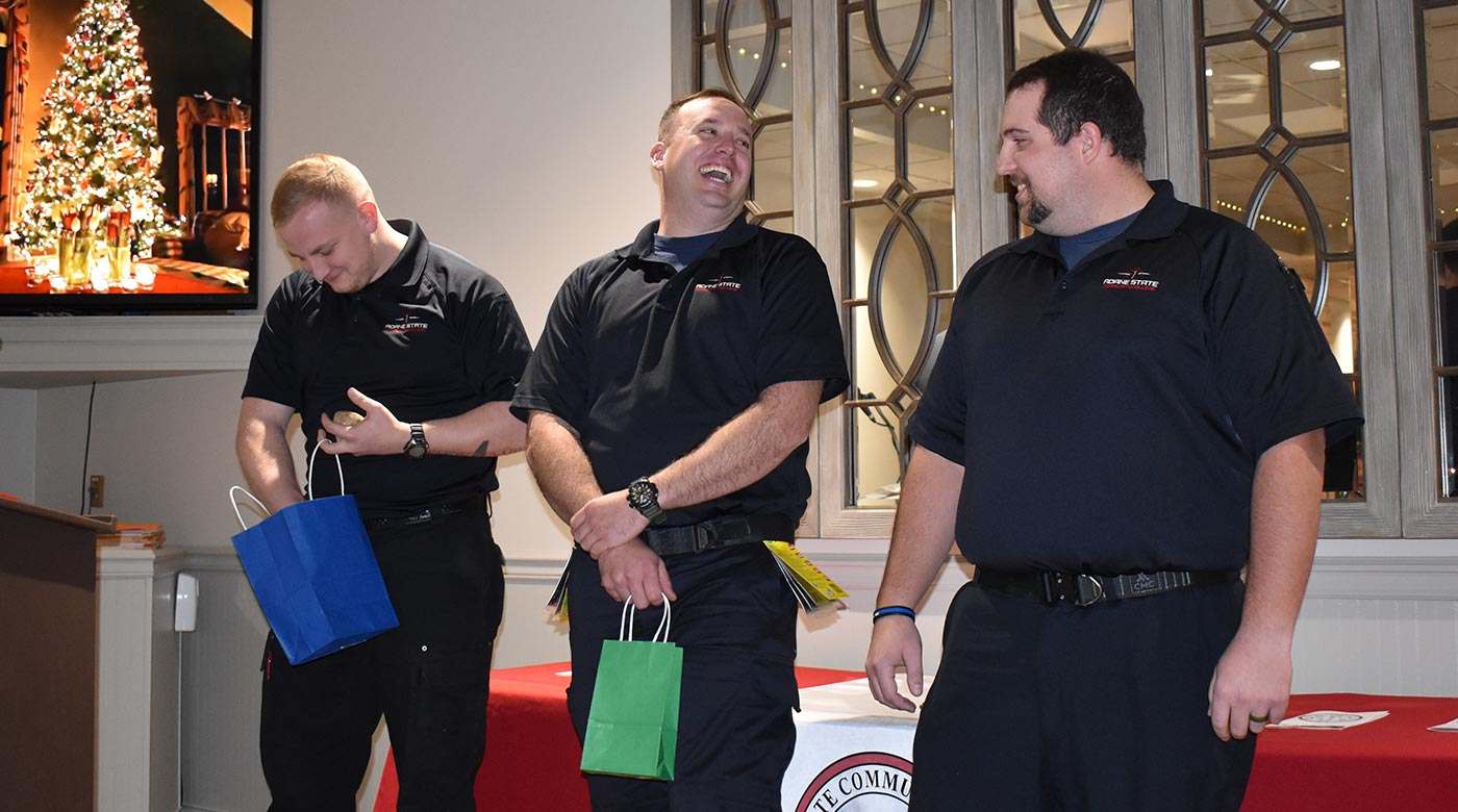 Three graduates of Roane State’s latest paramedics program received gag gifts during a luncheon in their honor. From left: Aaron Noe, Wes Horton and Blake Stout.
