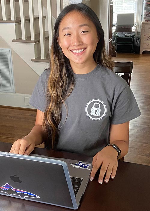 Student at their home attending Cybersecurity Camp