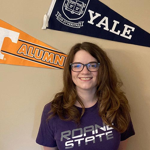 Katelyn Laughon with UT and Yale signs