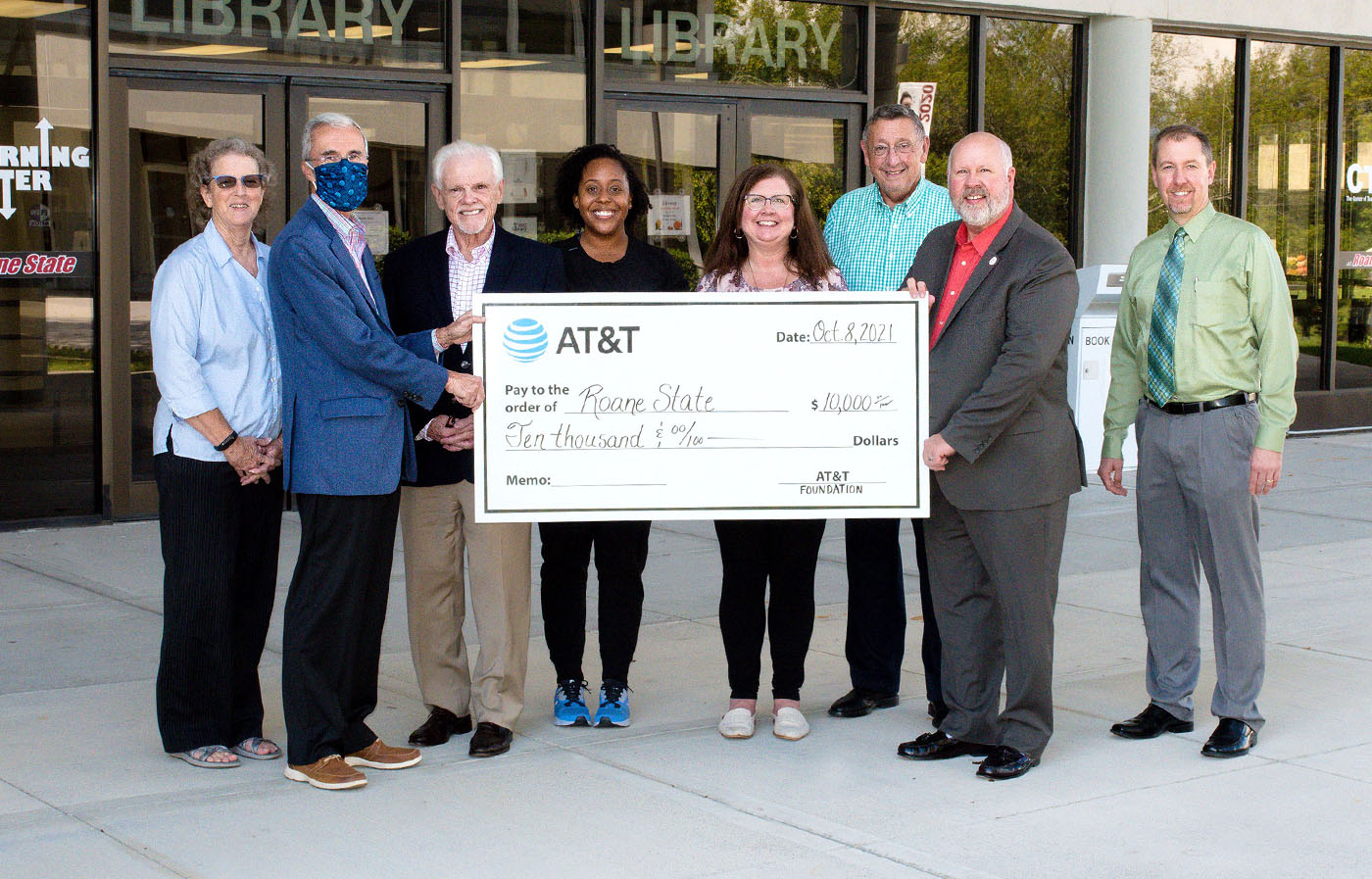 Group standing with a large check from AT&T for Roane State