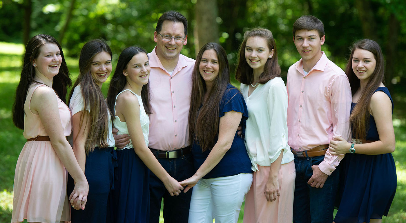 Moran family photo. Pictured from left: Emily, Meghan, Lily, Eddie, Kirstin, Anna, Bear, and Rebekah.
