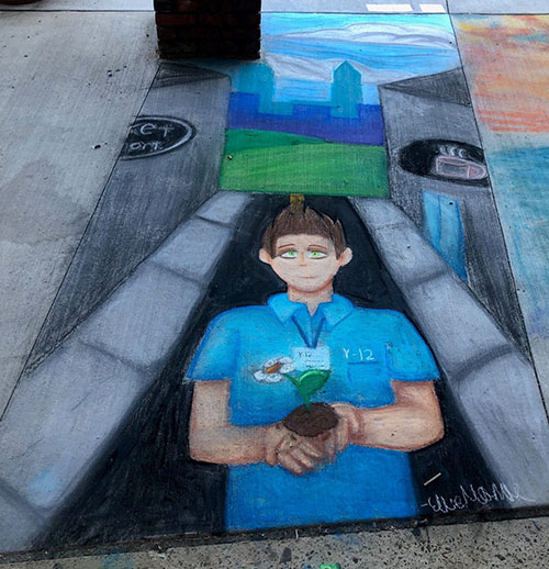 Painting of a person wearing a blue shirt with "Y-12" written on it and holding a flower. Painting's background is a street and buildings.