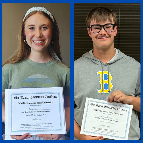 Two students holding scholarship certificates.