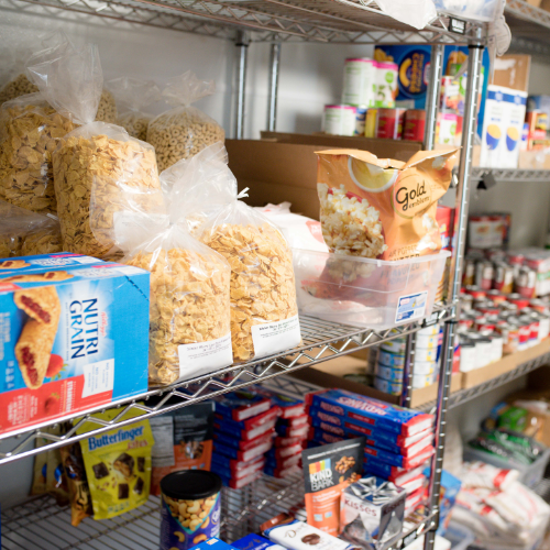 Items on shelves in a food pantry.