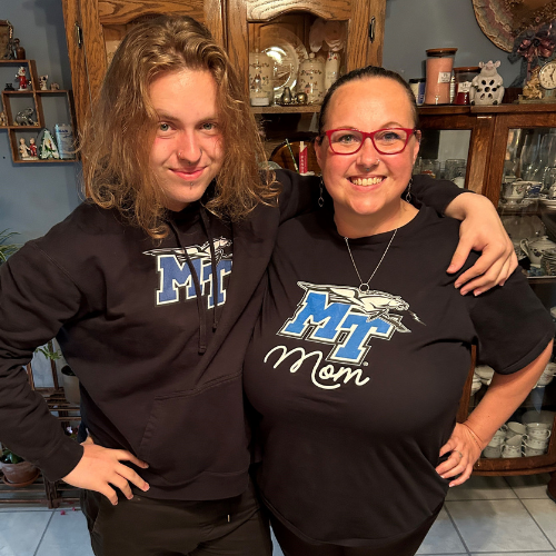 A mother and son pose for a photo wearing Middle Tennessee State University shirts.
