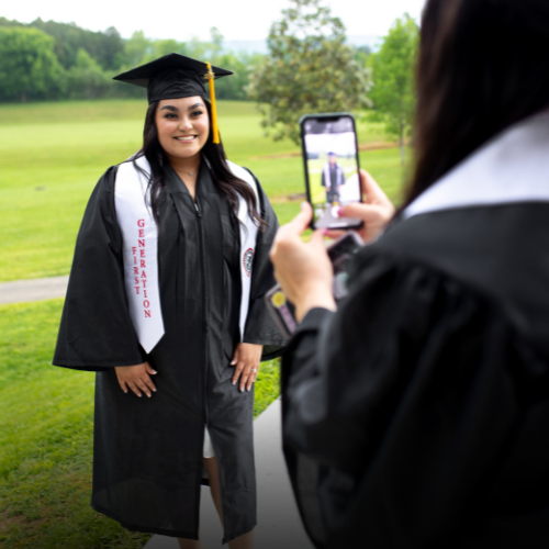 A college graduate with a First Generation stole.