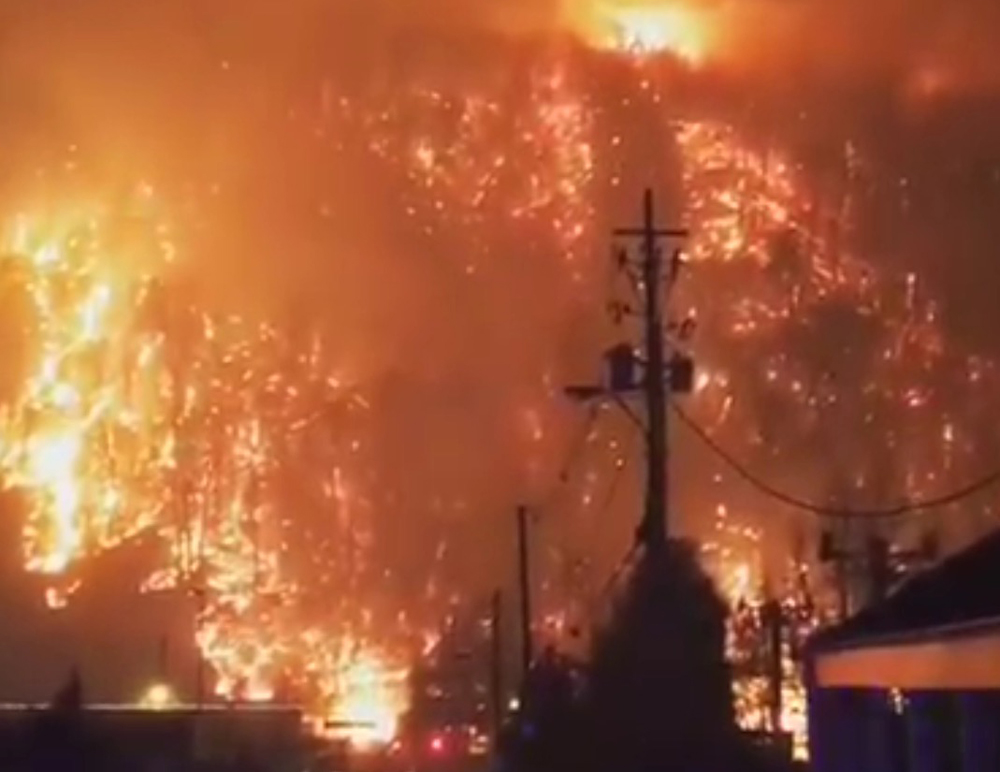 Wildfires in Gatinburg burn up the hillside near town