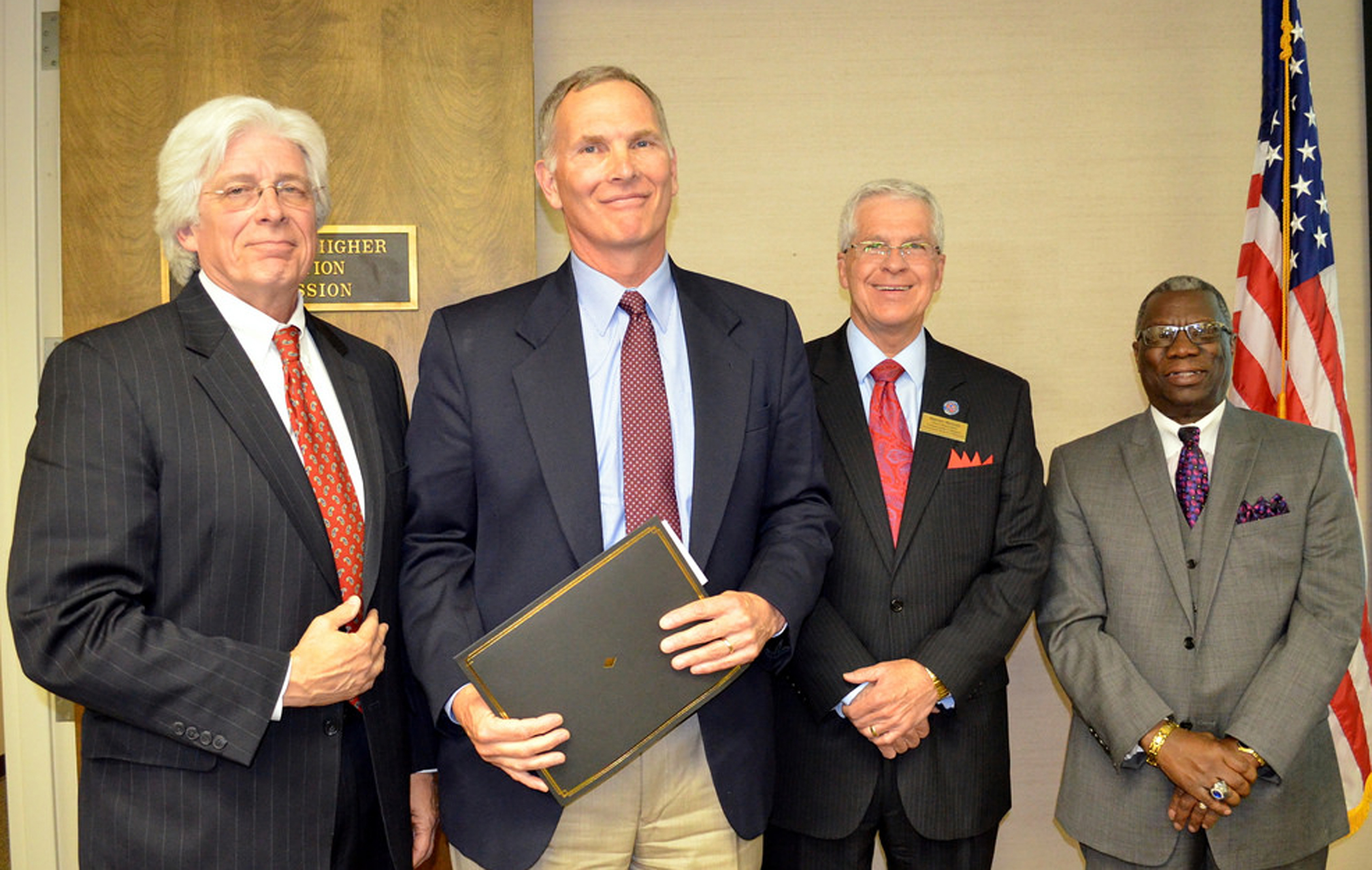 Roane State’s Brad Fox, second from left, is presented with the 2014 Harold Love Outstanding Community Involvement Award by, from left, Dr. Richard G. Rhoda (Tennessee Higher Education Commission), Dr. Warren Nichols (Tennessee Board of Regents), and Cato Johnson (Tennessee Higher Education Commission). 