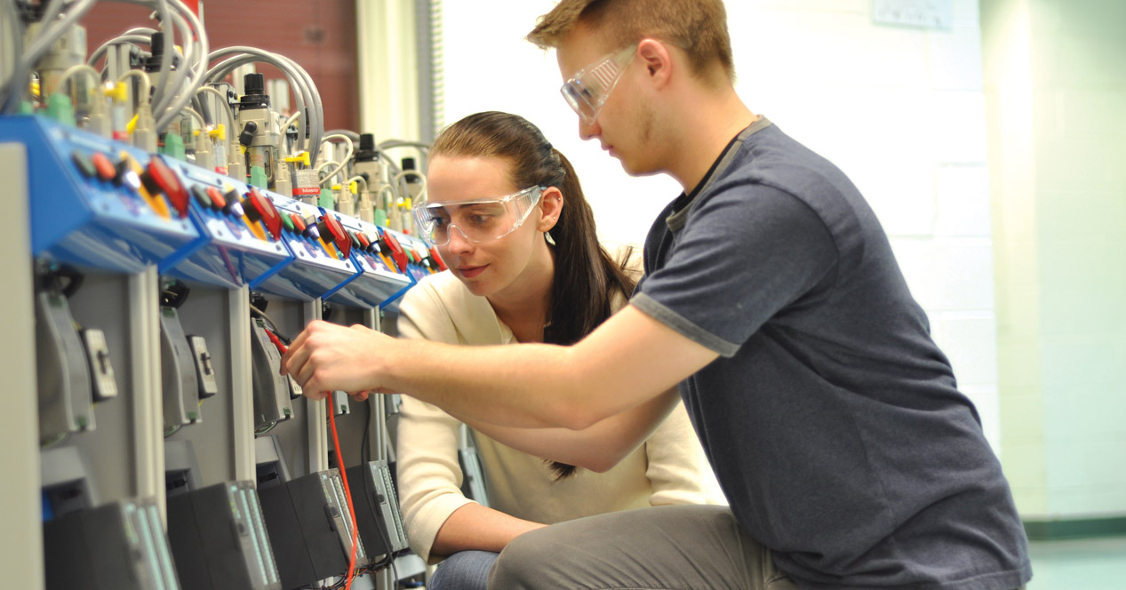 Students working with machinery