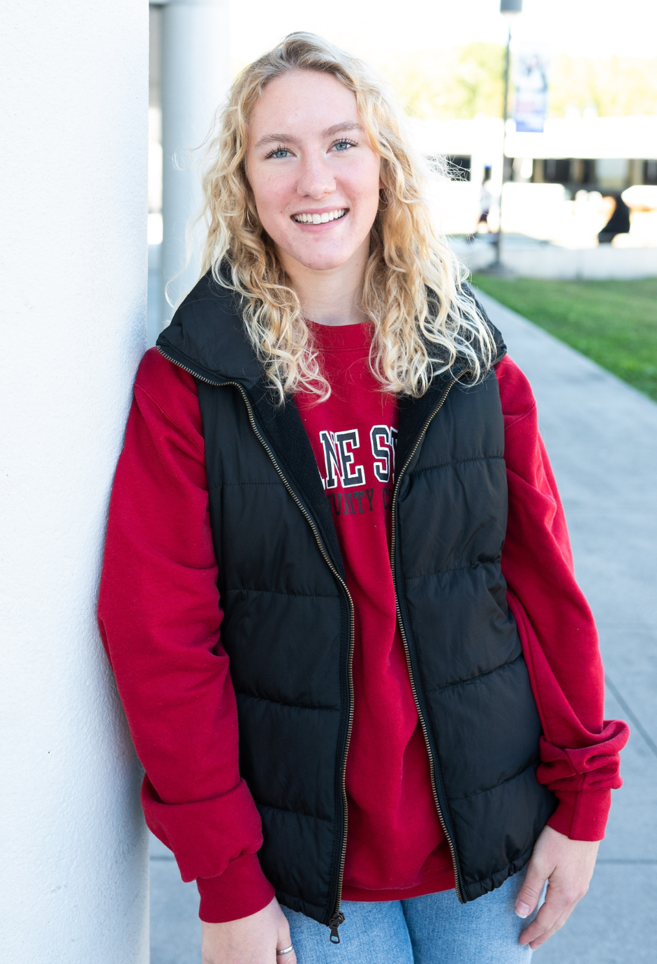 A student standing outside on campus.