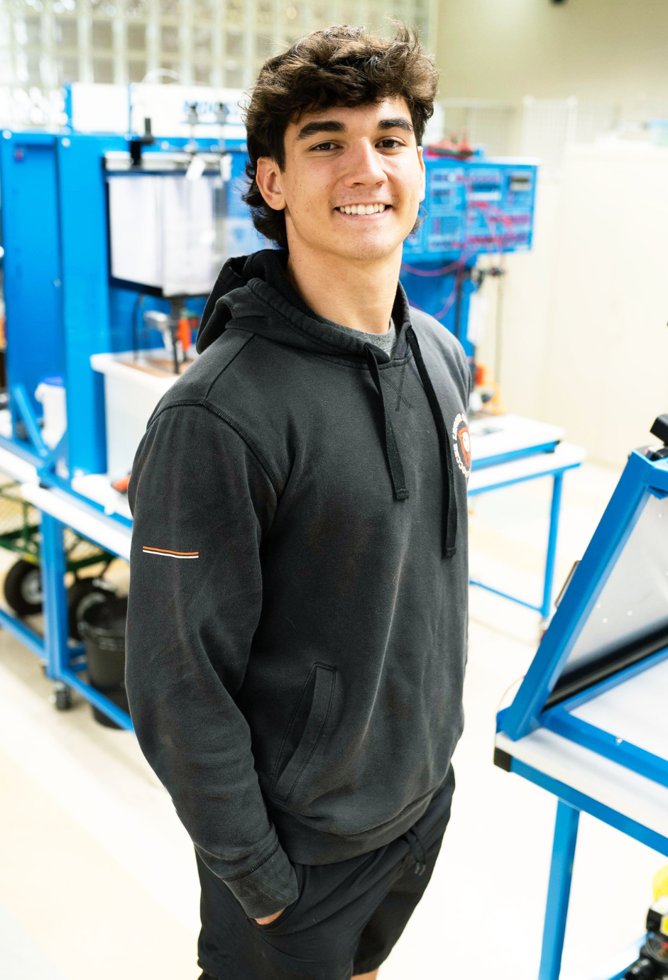 A student standing in a mechatronics lab.