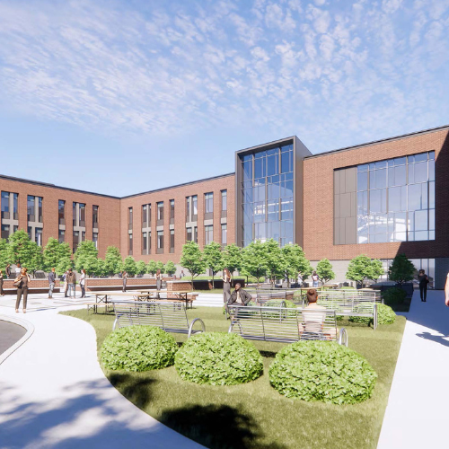 An architectural rendering of a brick building with large windows and a courtyard.